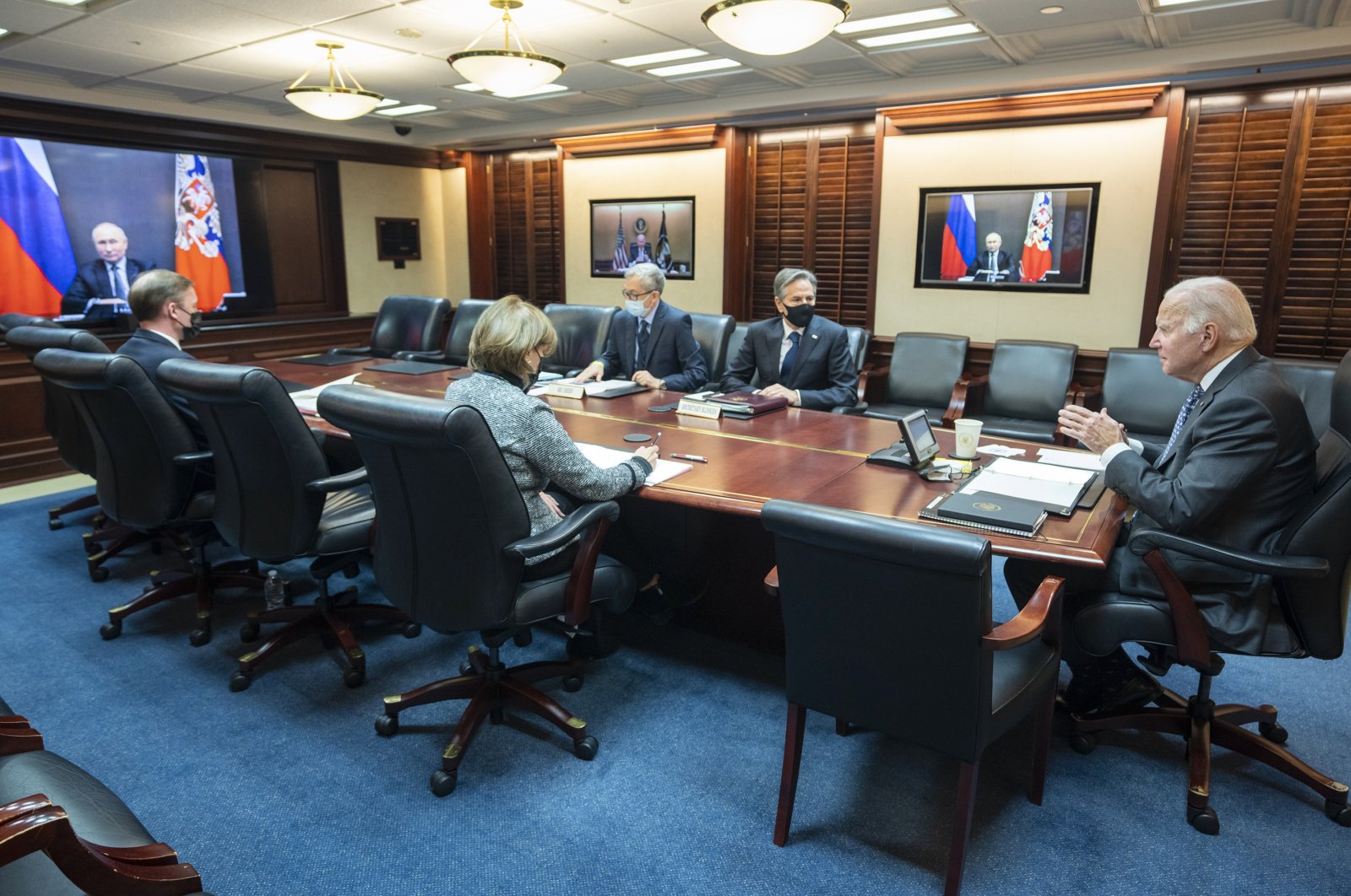 President Joe Biden (R) speaks as he virtually meets Russian President Vladimir Putin via a secured video conference from the Situation Room at the White House. Also seen are National Security Adviser Jake Sullivan (L) with Secretary of State Antony Blinken (2nd R) and National Security Council Senior Director for Russian and Central Asia, Eric Green, Washington, D.C., U.S., Dec. 7, 2021. (Photo by AP)