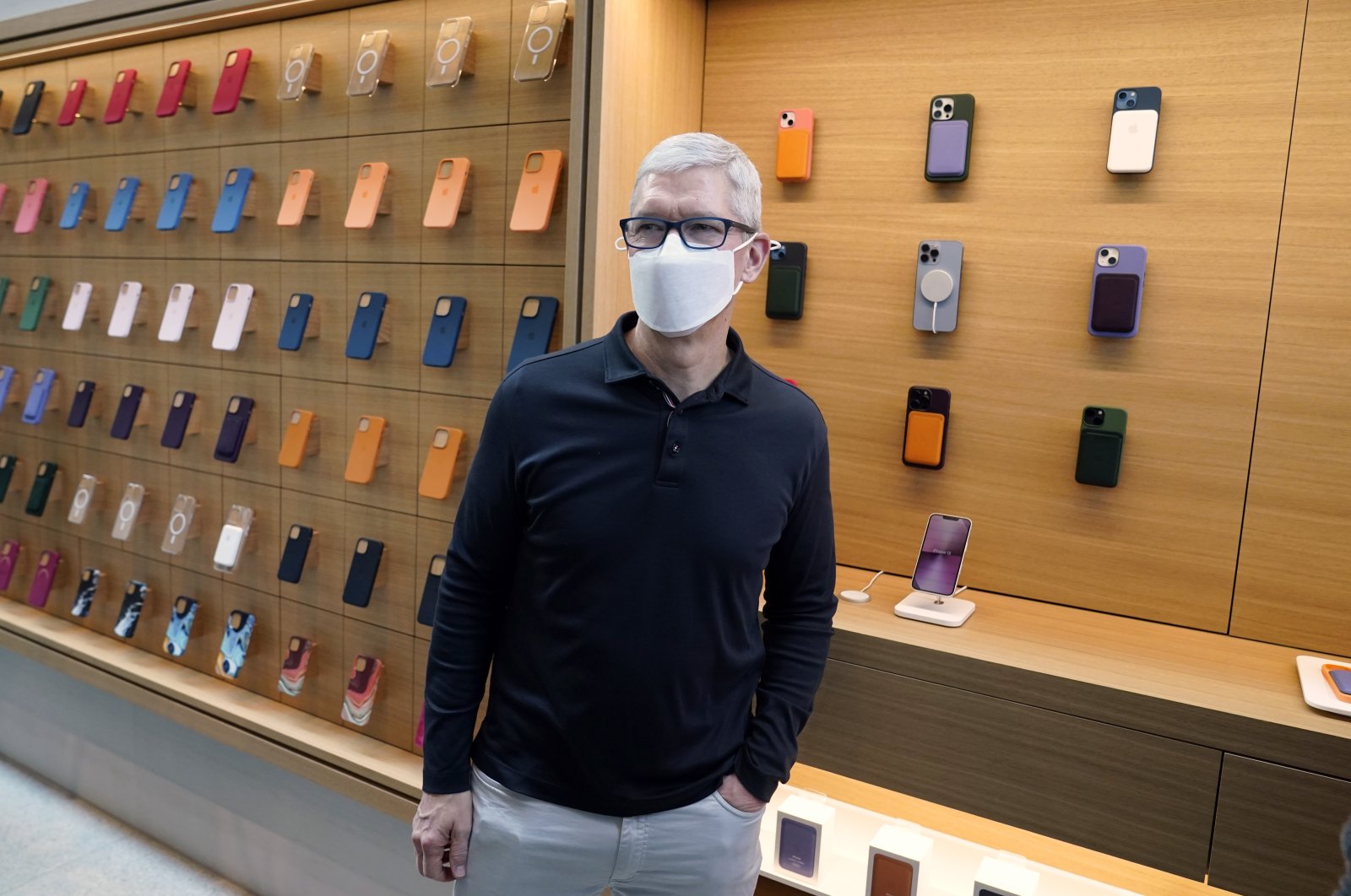 Apple CEO Tim Cook stands in front of company products during a visit to an Apple Store at The Grove, in Los Angeles, U.S., Nov. 19, 2021. (AP Photo)