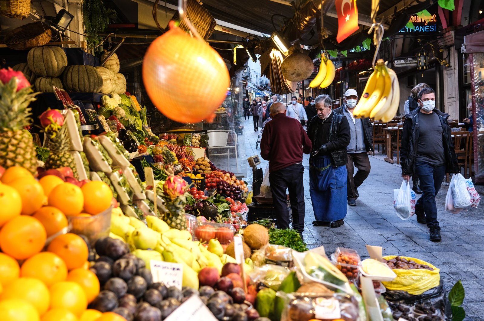 People shop for food near Istiklal Avenue in Istanbul, Turkey, Dec. 2, 2021. (EPA Photo)
