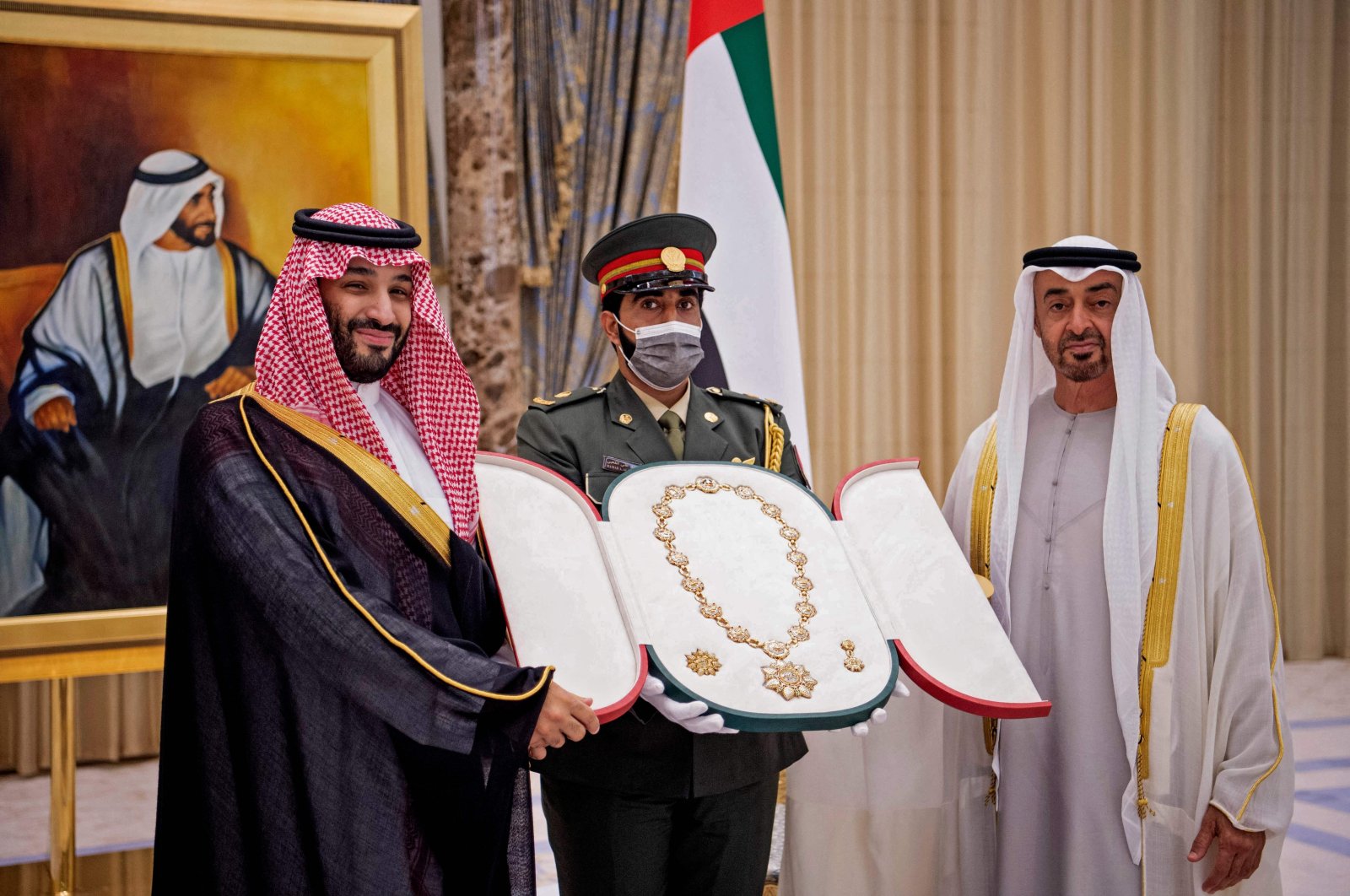 Abu Dhabi&#039;s Crown Prince Mohammed bin Zayed Al Nahyan (R) honoring Saudi Arabia&#039;s Crown Prince Mohammed bin Salman (L) with the Order of Zayed, First Class, in Abu Dhabi, UAE, Dec. 7, 2021. (Saudi Royal Palace via AFP)