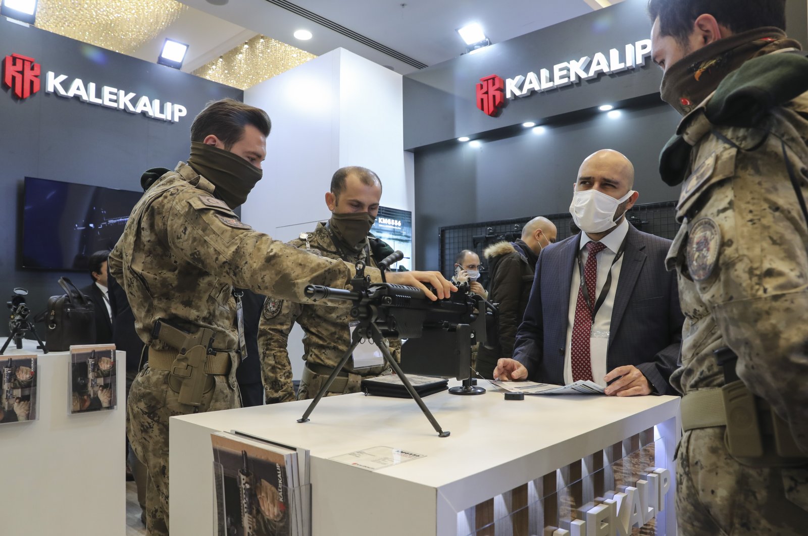 Visitors receive information from local defense firm Kalekalıp on their products at the DLSS, Ankara, Turkey, Dec. 7, 2021. (AA Photo)