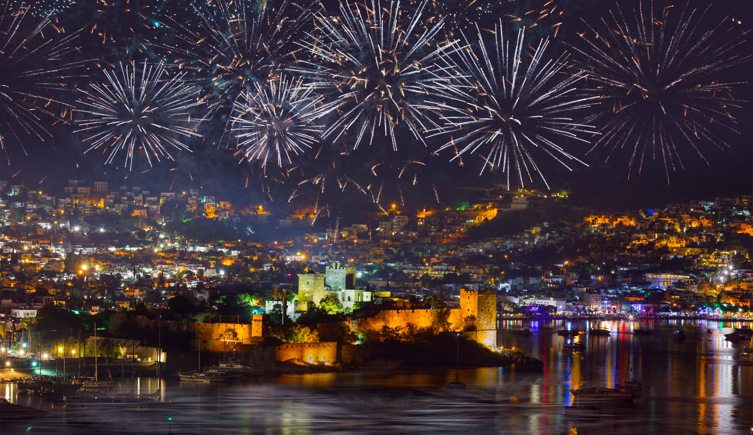 Aerial view of Bodrum resort town on Turkish Riviera at night with fireworks. (Shutterstock Photo) 