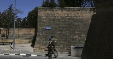 U.N peacekeepers walk by the Venice wall at the medieval core across the U.N buffer zone, in the divided capital Lefkoşa (Nicosia), Cyprus, April 26, 2021. (AP File Photo)