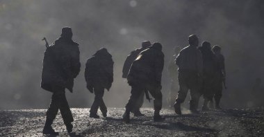Armenian soldiers walk along the road near the border between Nagorno-Karabakh and Armenia, Nov. 8, 2020.  (AP File Photo)