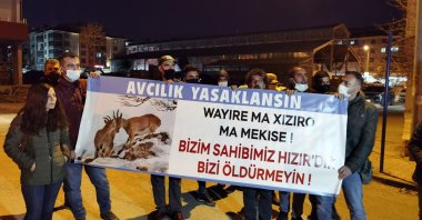 Activists hold a banner calling for a ban on hunting, in Tunceli, eastern Turkey, Dec. 8, 2021. (DHA PHOTO) 
