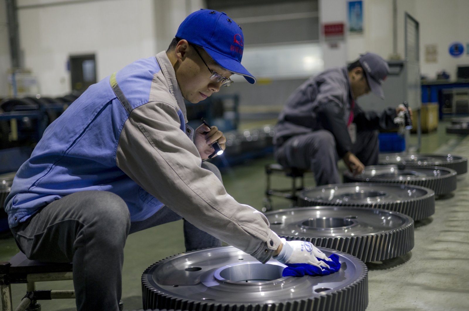 People work in a locomotive factory, in Changzhou, Jiangsu province, China, Dec. 7, 2021. (EPA Photo)