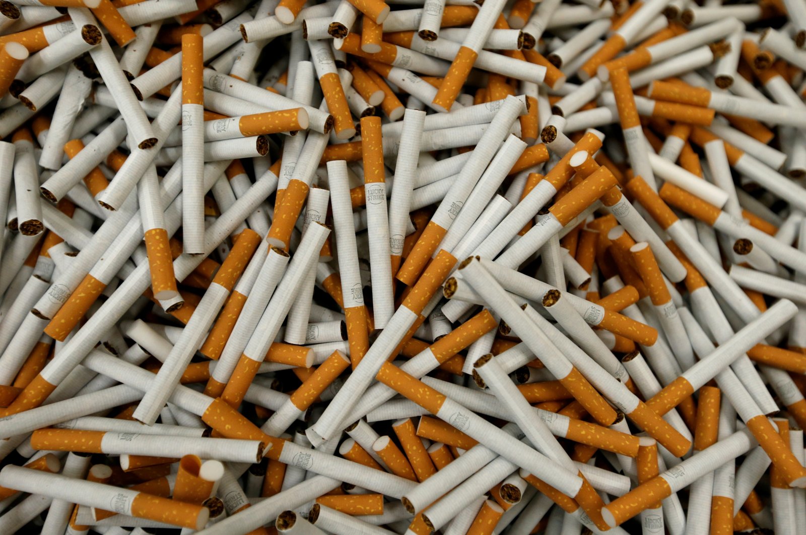 Lucky Strike cigarettes are seen during the manufacturing process in the British American Tobacco Cigarette Factory (BAT) in Bayreuth, Germany, April 30, 2014. (REUTERS/Michaela Rehle/File Photo)