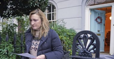 Allegra Stratton speaks outside her home in north London, Dec. 8, 2021. (AP Photo)