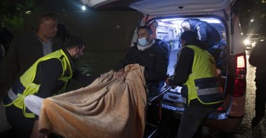 Former Palestinian prisoner Khaled Fasfous is taken out of an ambulance at the tomb of Palestinian leader Yasser Arafat, in the occupied West Bank city of Ramallah, Palestine, Dec. 5, 2021. (AP Photo)
