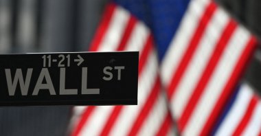A Wall Street sign at the New York Stock Exchange (NYSE) is seen in New York City, New York, U.S., Feb. 17, 2021. (AFP Photo)