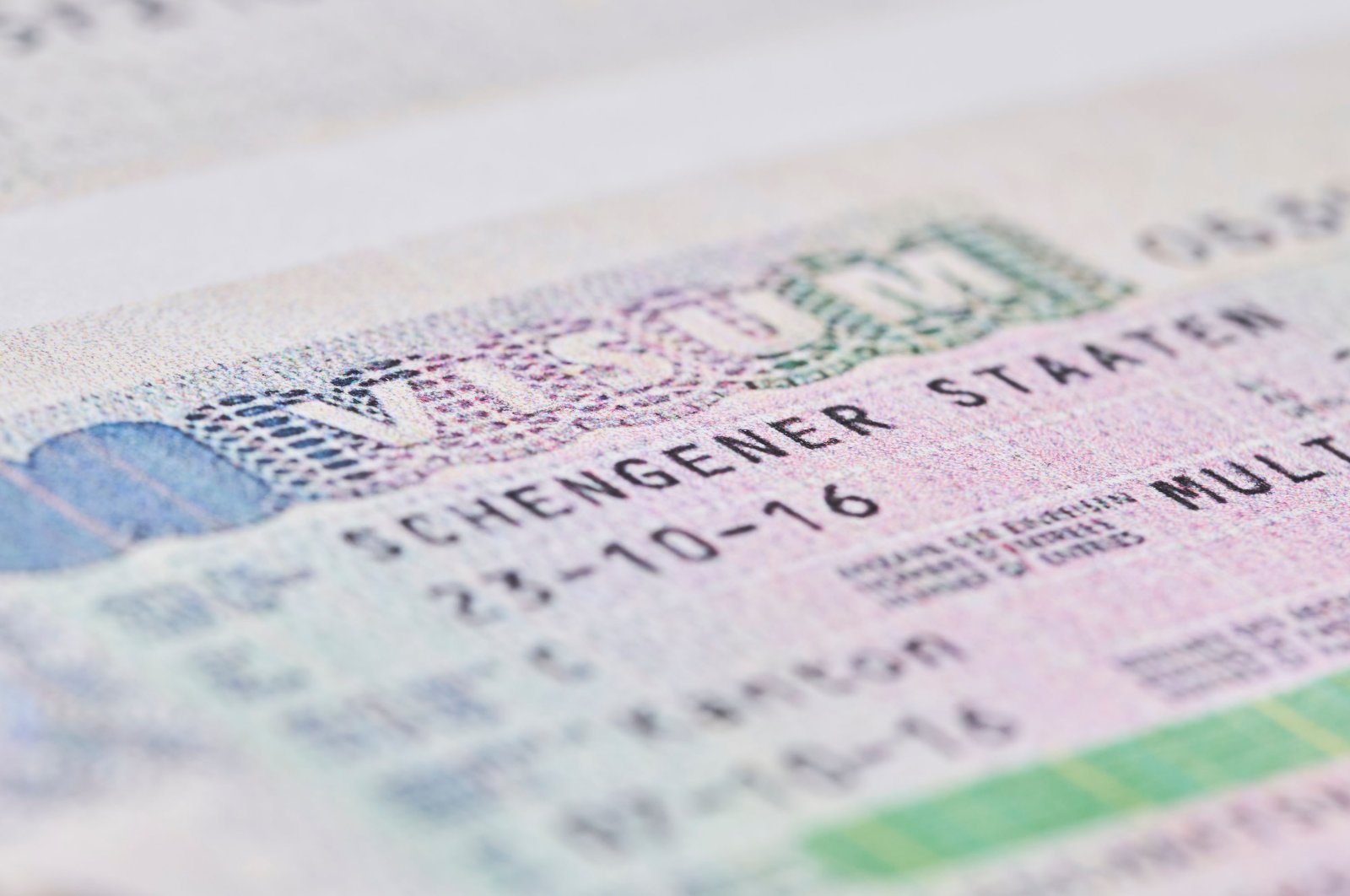 A close-up shot of a Schengen visa on a passport. (Shutterstock Photo)