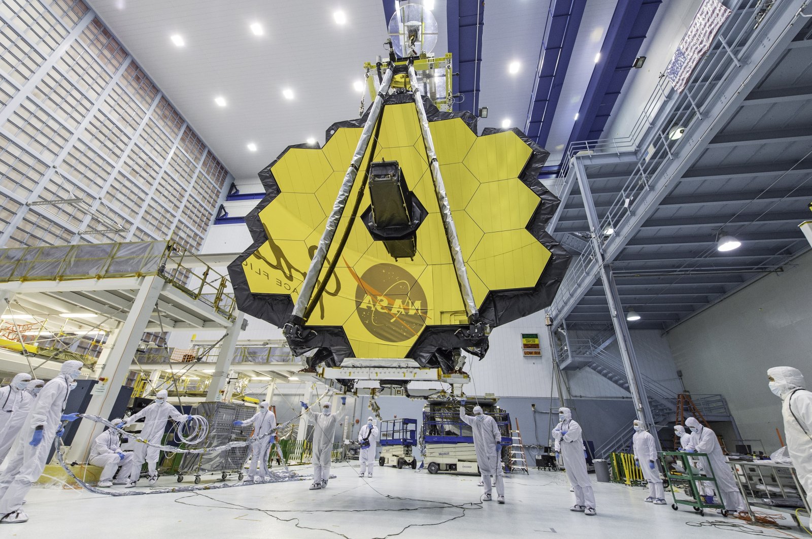 An undated handout file picture made available by NASA shows NASA technicians lifting the James Webb Space Telescope using a crane and moving it inside a clean room at NASA&#039;s Goddard Space Flight Center in Greenbelt, Maryland, U.S., issued on Dec.1, 2021. (NASA Photo via EPA)