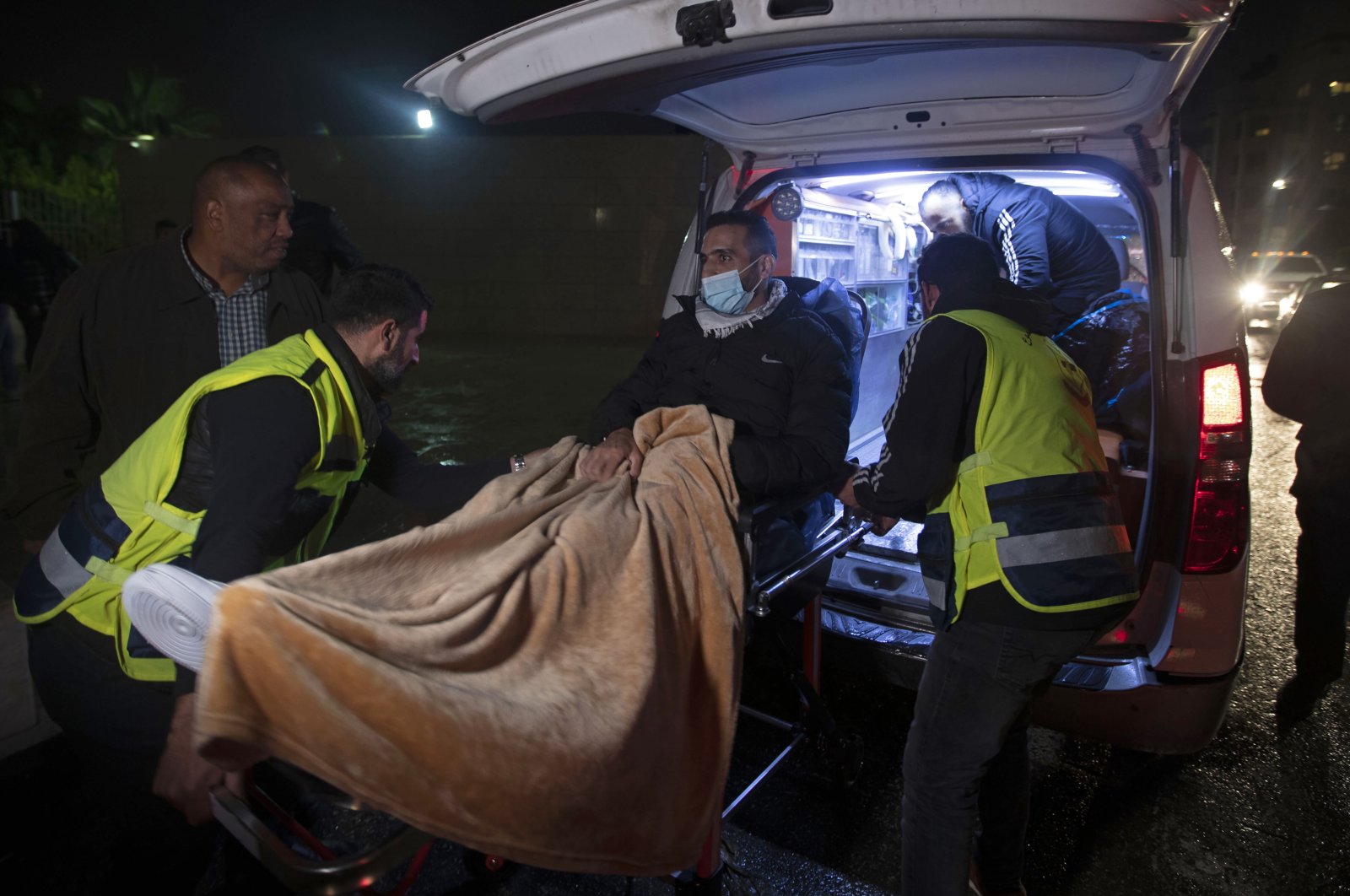 Former Palestinian prisoner Khaled Fasfous is taken out of an ambulance at the tomb of Palestinian leader Yasser Arafat, in the occupied West Bank city of Ramallah, Palestine, Dec. 5, 2021. (AP Photo)