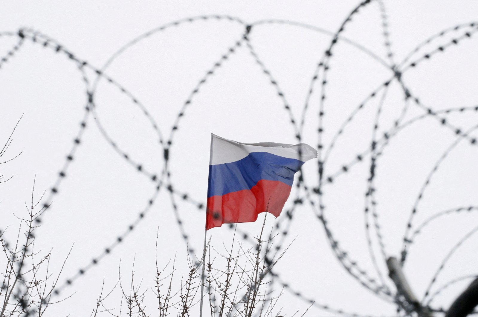 The Russian flag is seen through barbed wire as it flies on the roof of the Russian embassy in Kyiv, Ukraine, March 26, 2018. (Reuters Photo)
