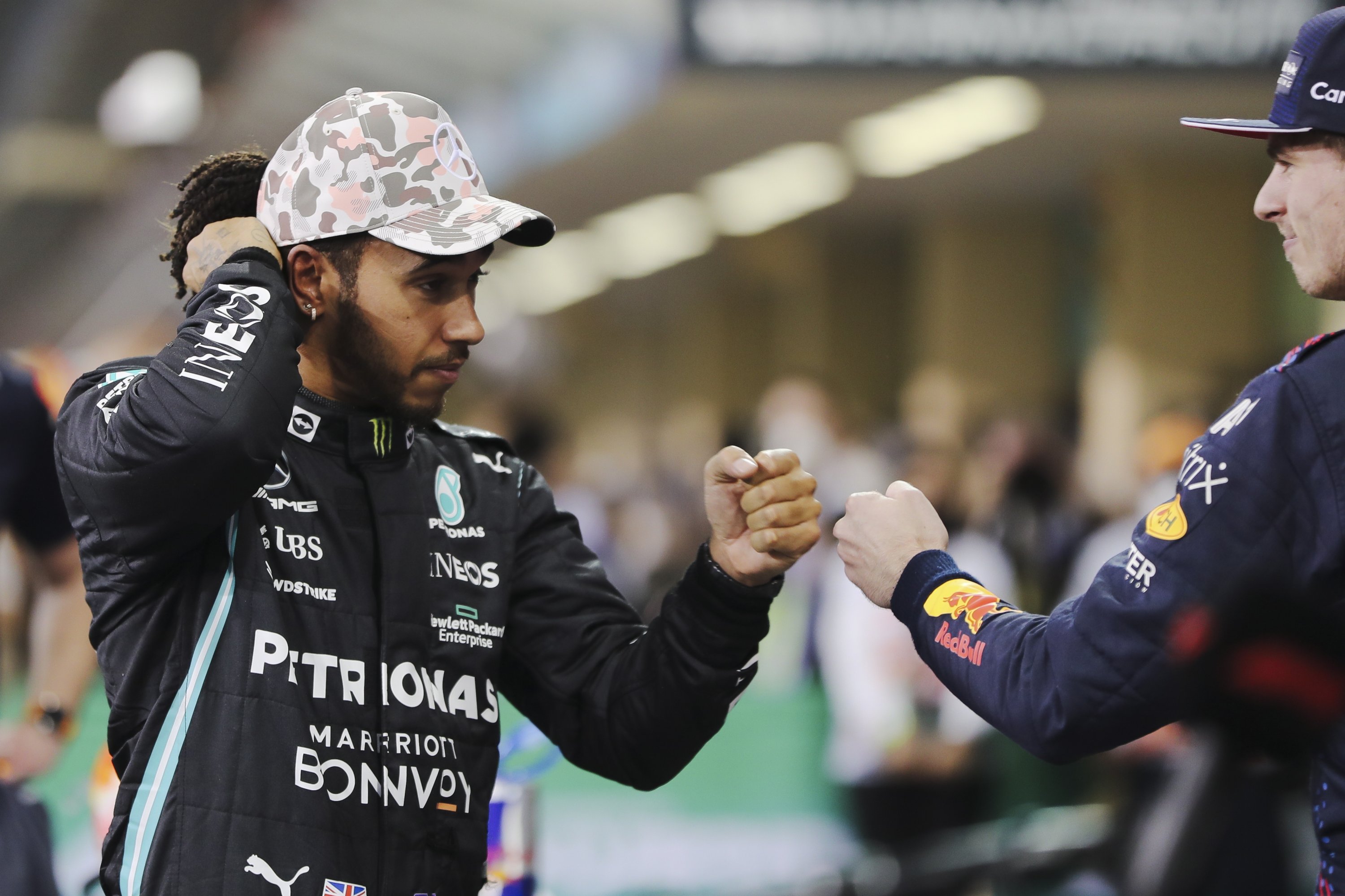 British Formula One driver Lewis Hamilton (L) of Mercedes-AMG Petronas and Dutch driver Max Verstappen (R) of Red Bull Racing react after the qualifying session of the Formula One Grand Prix of Abu Dhabi at Yas Marina Circuit in Abu Dhabi, United Arab Emirates, Dec. 11, 2021. (EPA Photo)