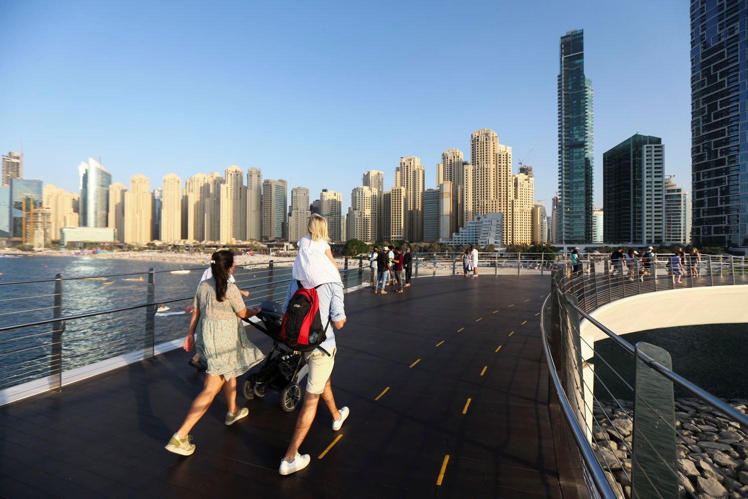 People walk on the Pedestrian Bridge at the Bluewaters Island in Dubai, United Arab Emirates, Dec. 8, 2021. (Reuters Photo)
