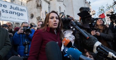 Julian Assange's fiancee Stella Moris speaking with journalists outside the Royal Courts of Justice in London, U.K., Dec. 10, 2021. (AA Photo)