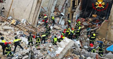 Firefighters work after a four-story apartment building collapsed, following a gas explosion, in Ravanusa, Sicily, Italy, Dec. 12, 2021. (Vigili del Fuoco via AFP)