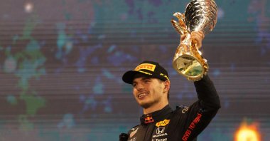 Red Bull's Max Verstappen celebrates winning the Abu Dhabi Grand Prix and the F1 world championship at the Yas Marina Circuit, Abu Dhabi, UAE, Dec. 12, 2021. (Reuters Photo)