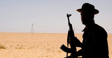 A member of putschist Gen. Khalifa Haftar's army sits in a tent at one of their sites in the west of Sirte, Libya, Aug. 19, 2020. (Reuters File Photo)
