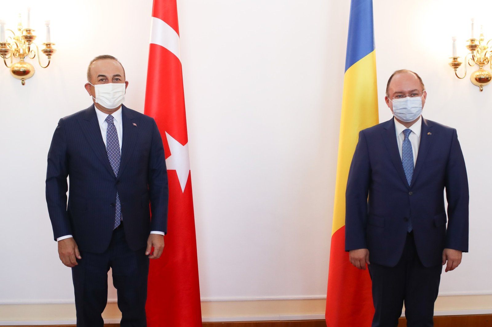 Foreign Minister Mevlüt Çavuşoğlu (L) and Romanian Foreign Minister Bogdan Aurescu meet in Bucharest, Romania, April 22, 2021. (AA Photo)