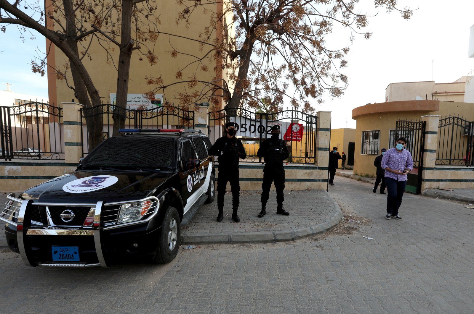 Security personnel stand guard near a polling station during the municipal elections in Tripoli, Libya, Feb. 6, 2021. (REUTERS Photo)