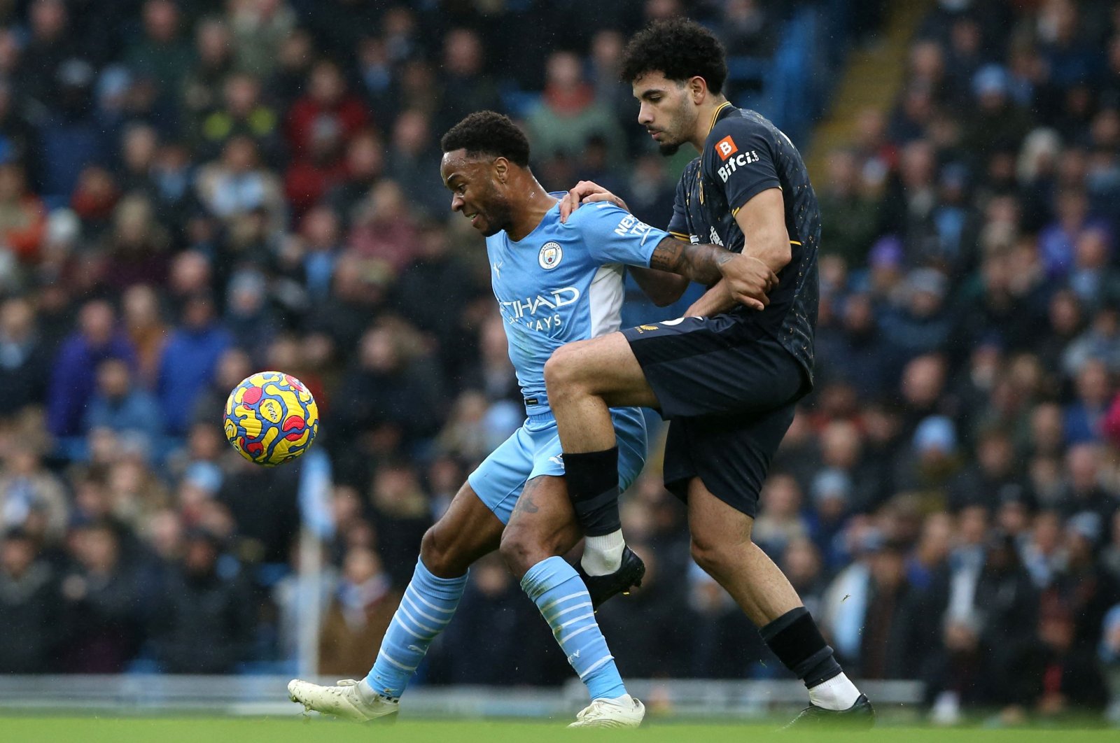 Man City&#039;s Raheem Sterling (L) vies with Wolves&#039; Rayan Ait-Nouri during a Premier League match at the Etihad Stadium, Manchester, England, Dec. 11, 2021. (AFP Photo)