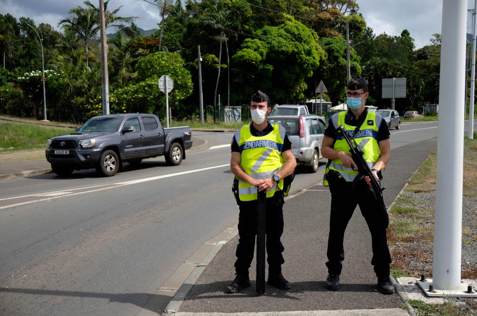Gendarmerie forces with automatic rifles on the road of Saint Michel, on referendum day, in Mont Dore, New Caledonia, Dec. 12, 2021. (AFP Photo)