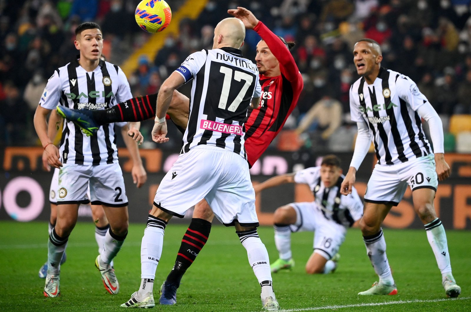 AC Milan&#039;s Zlatan Ibrahimovic (C) shoots and scores in a Serie A match against Udinese, Dec. 11, 2021. (AFP Photo)