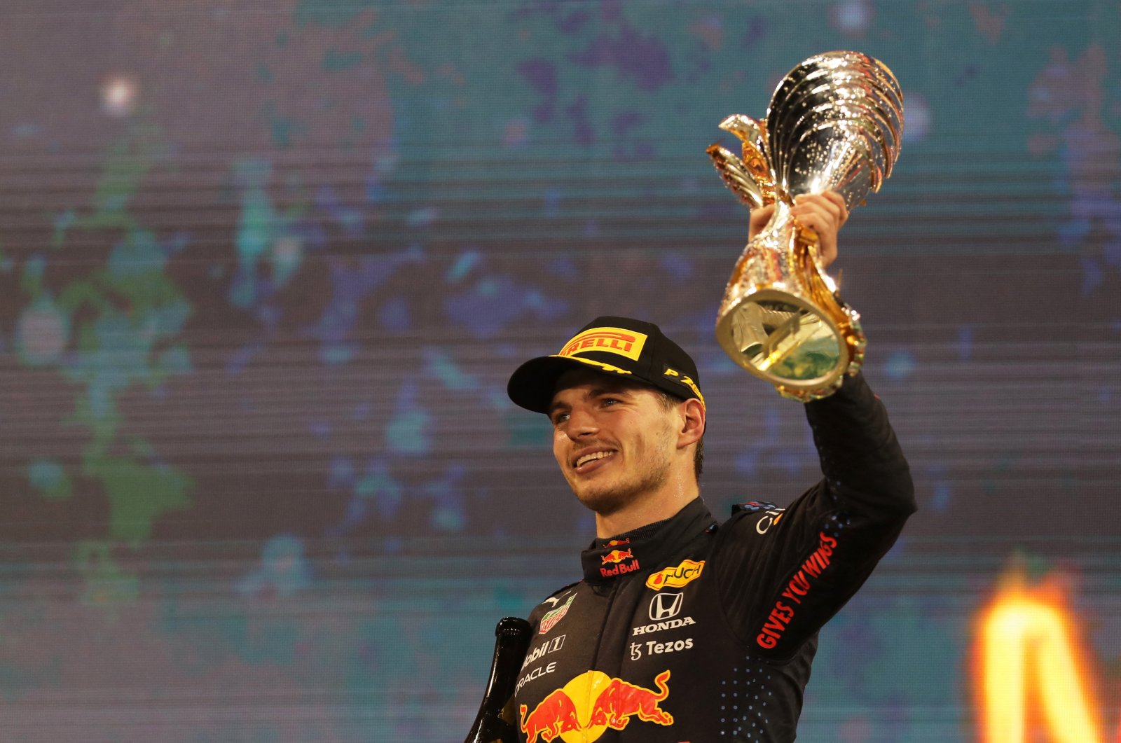 Red Bull&#039;s Max Verstappen celebrates winning the Abu Dhabi Grand Prix and the F1 world championship at the Yas Marina Circuit, Abu Dhabi, UAE, Dec. 12, 2021. (Reuters Photo)