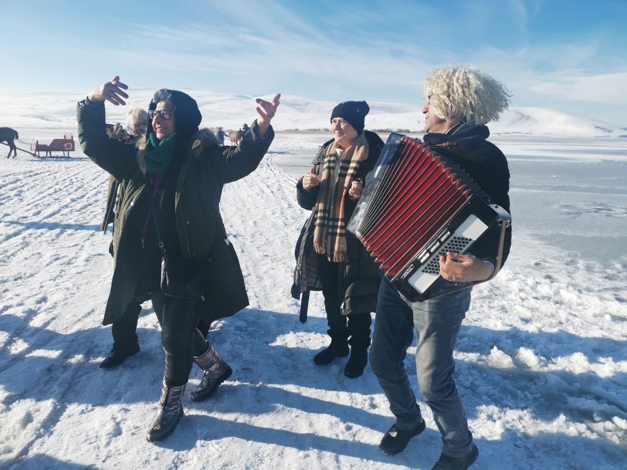 People dancing on the frozen surface of Lake Çıldır in the Çıldır district of Ardahan province, eastern Turkey, Dec. 12, 2021. (AA Photo)