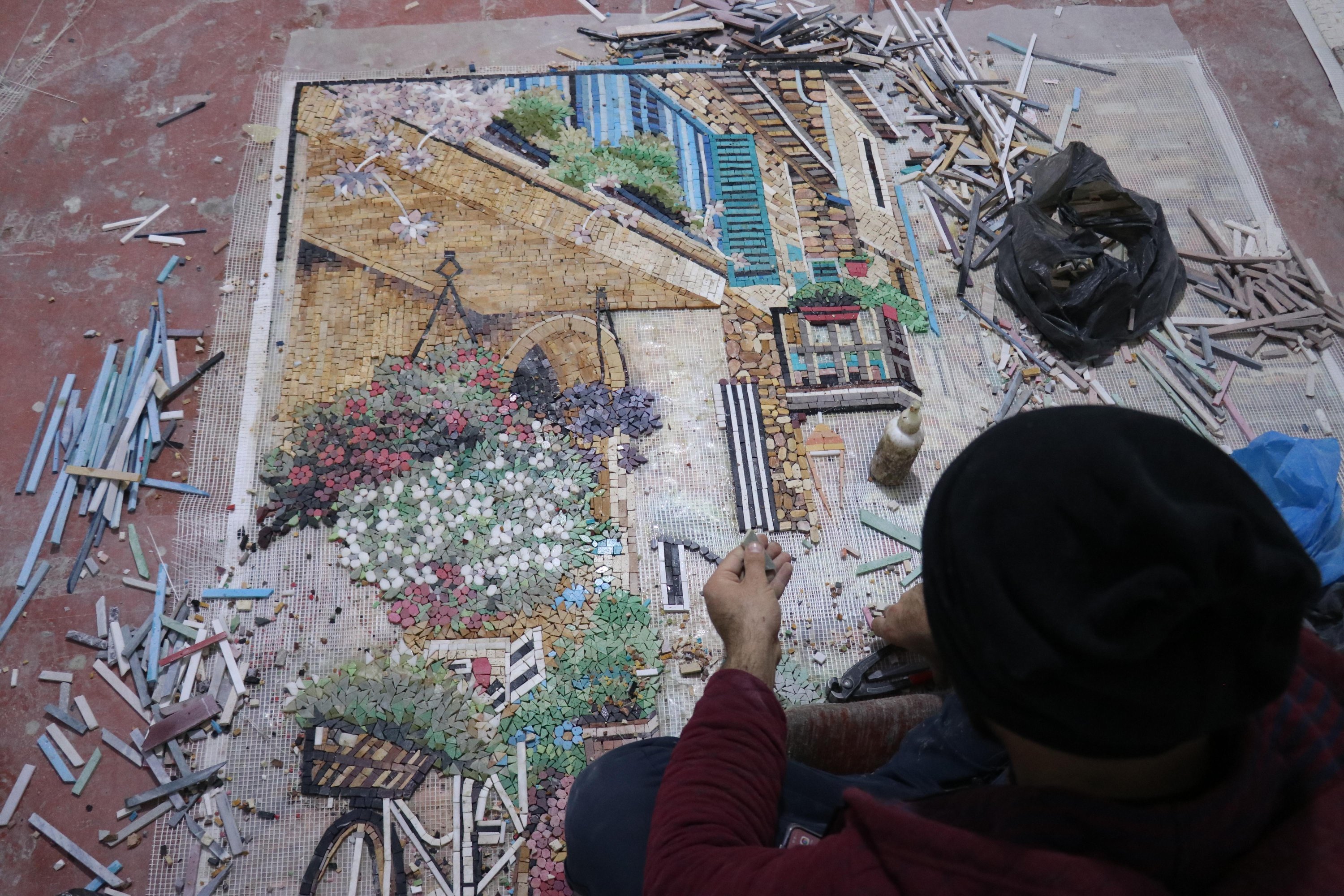 An employee works on a mosaic in the workshop of Zemzem Gök and Fatma Dendüş, Hatay, southern Turkey, Dec. 12, 2021. (AA)