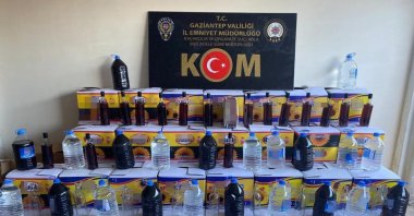 A police display of bootleg liquor seized in operations, in Gaziantep, southern Turkey, Dec. 6, 2021. (IHA PHOTO)