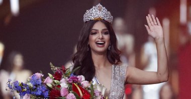 India&#039;s Harnaaz Sandhu waves after being crowned Miss Universe 2021 during the 70th Miss Universe pageant, Eilat, Israel, Dec. 13, 2021. (AP Photo)