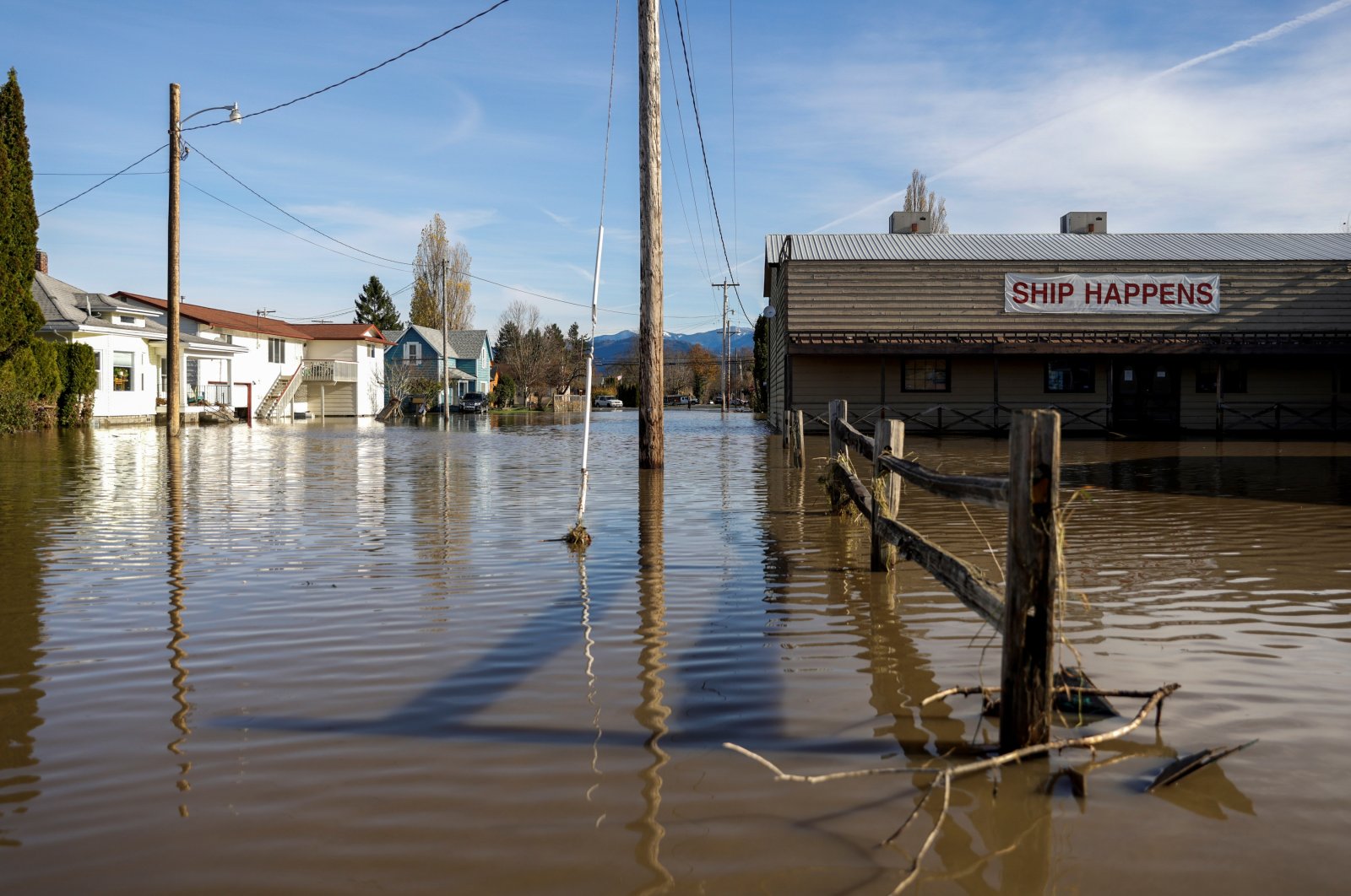 Flood waters surround a shipping business called &quot;Ship Happens&quot; after rainstorms that hit both British Columbia and Washington state caused flooding on both sides of the border, in Sumas, Washington, U.S., Nov. 17, 2021.  (Reuters Photo)