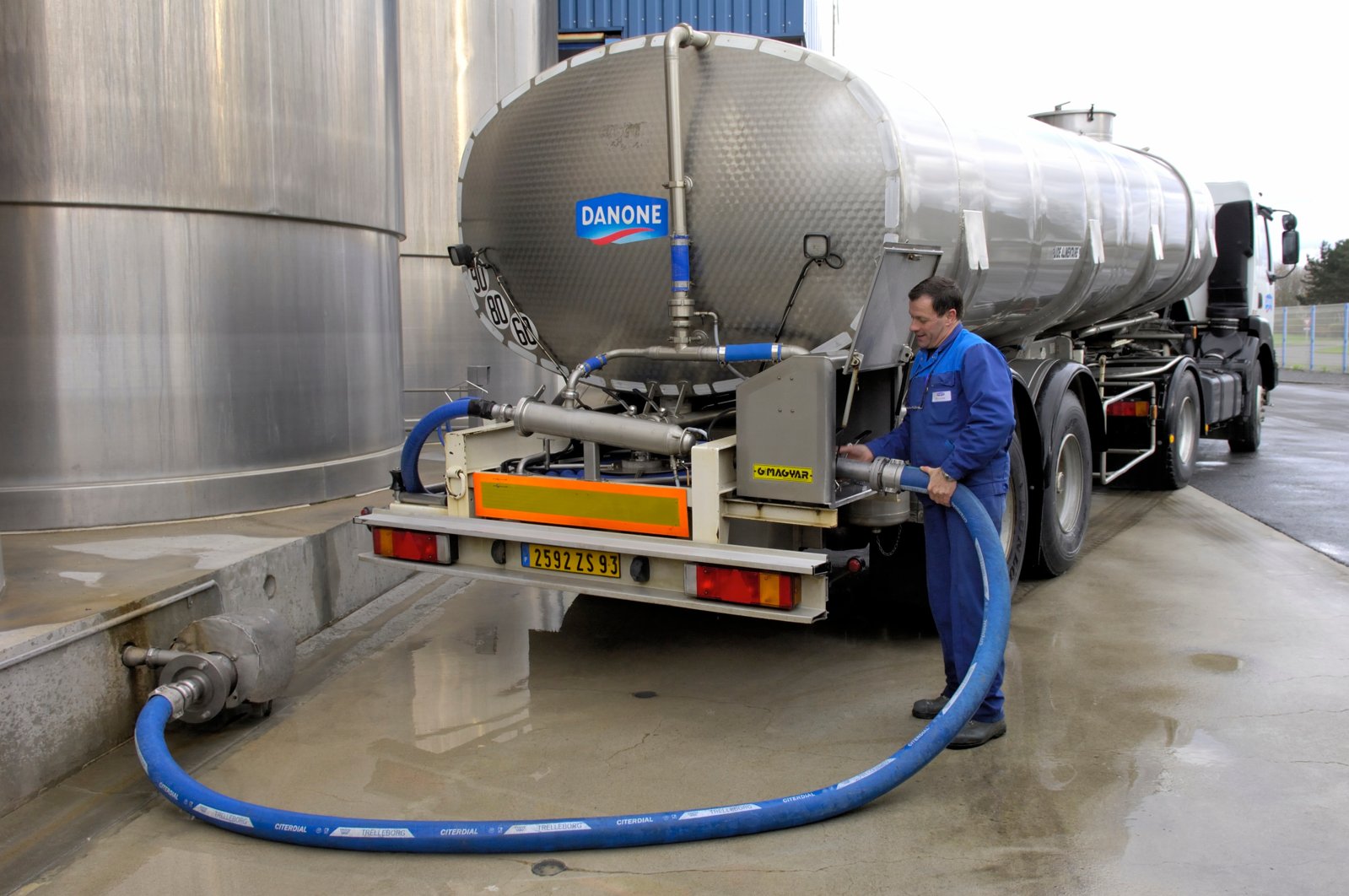 Milk tanker trucks in the unloading area at Danone dairy plant in Normandy, France. (Shutterstock Photo) 

