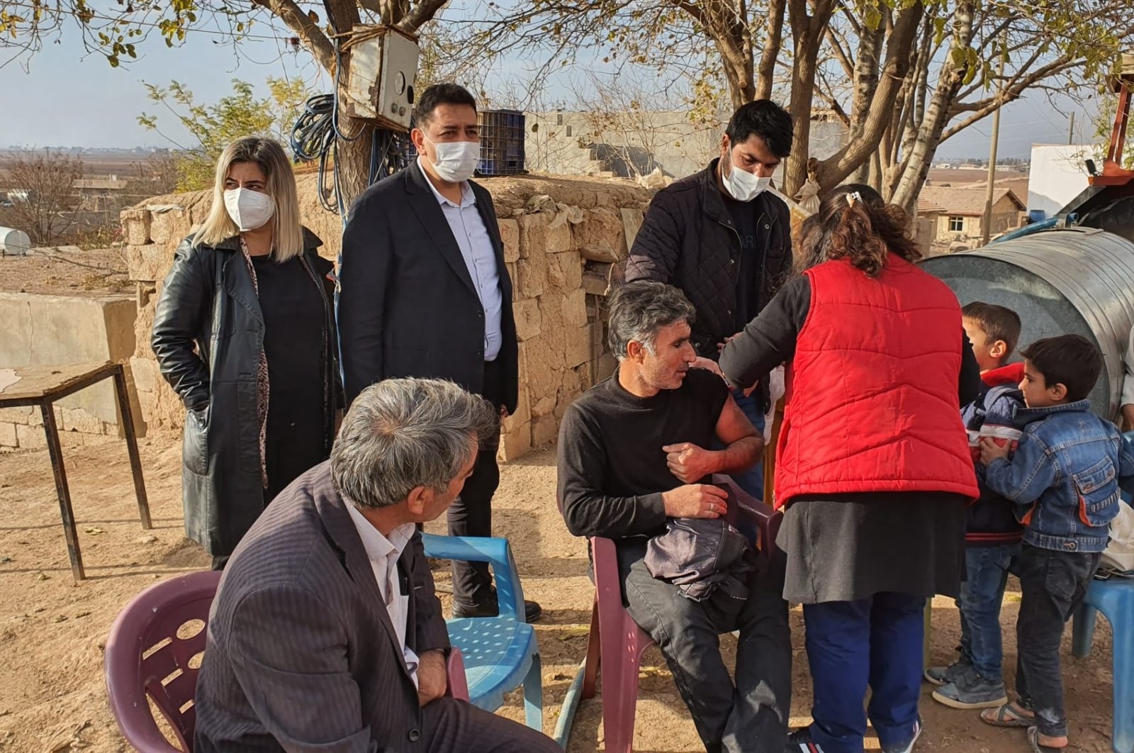 People get vaccinated for COVID-19 in a rural neighborhood, in Şanlıurfa, southeastern Turkey, Dec. 8, 2021. (AA PHOTO)