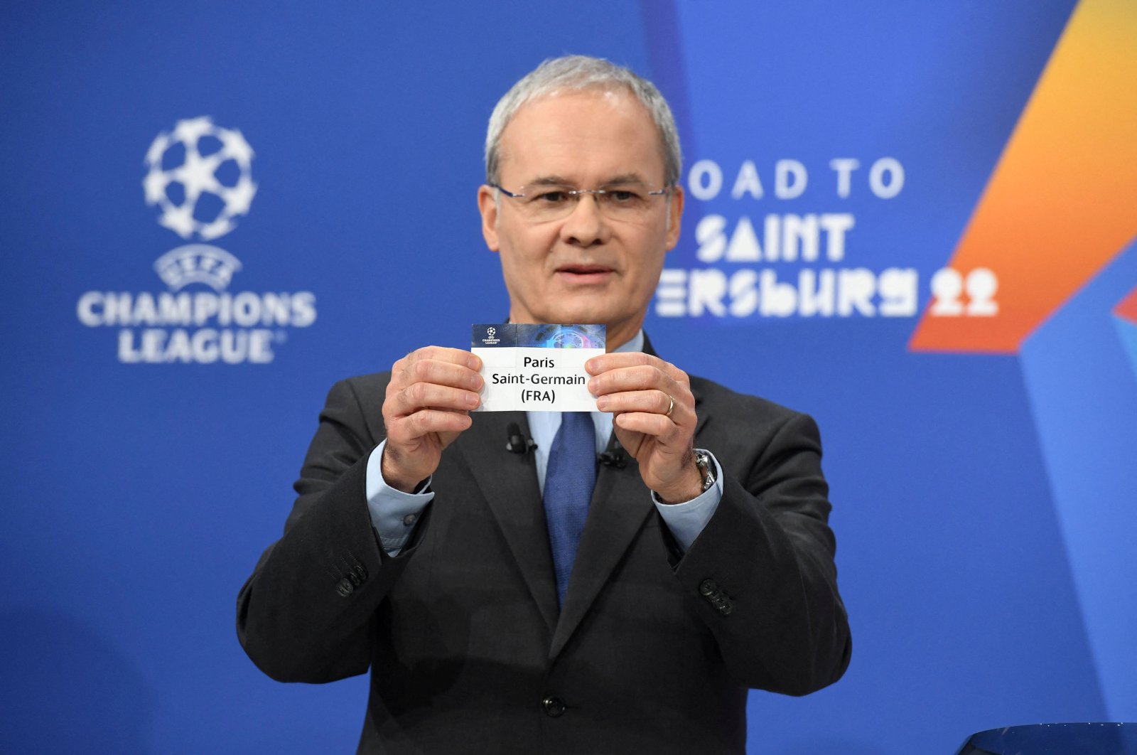 UEFA Deputy General Secretary Giorgio Marchetti draws out the card of Paris Saint-Germain during the UEFA Champions League 2021/22 Round of 16 Draw at the UEFA headquarters, Nyon, Switzerland, Dec. 13, 2021. (Reuters Photo)