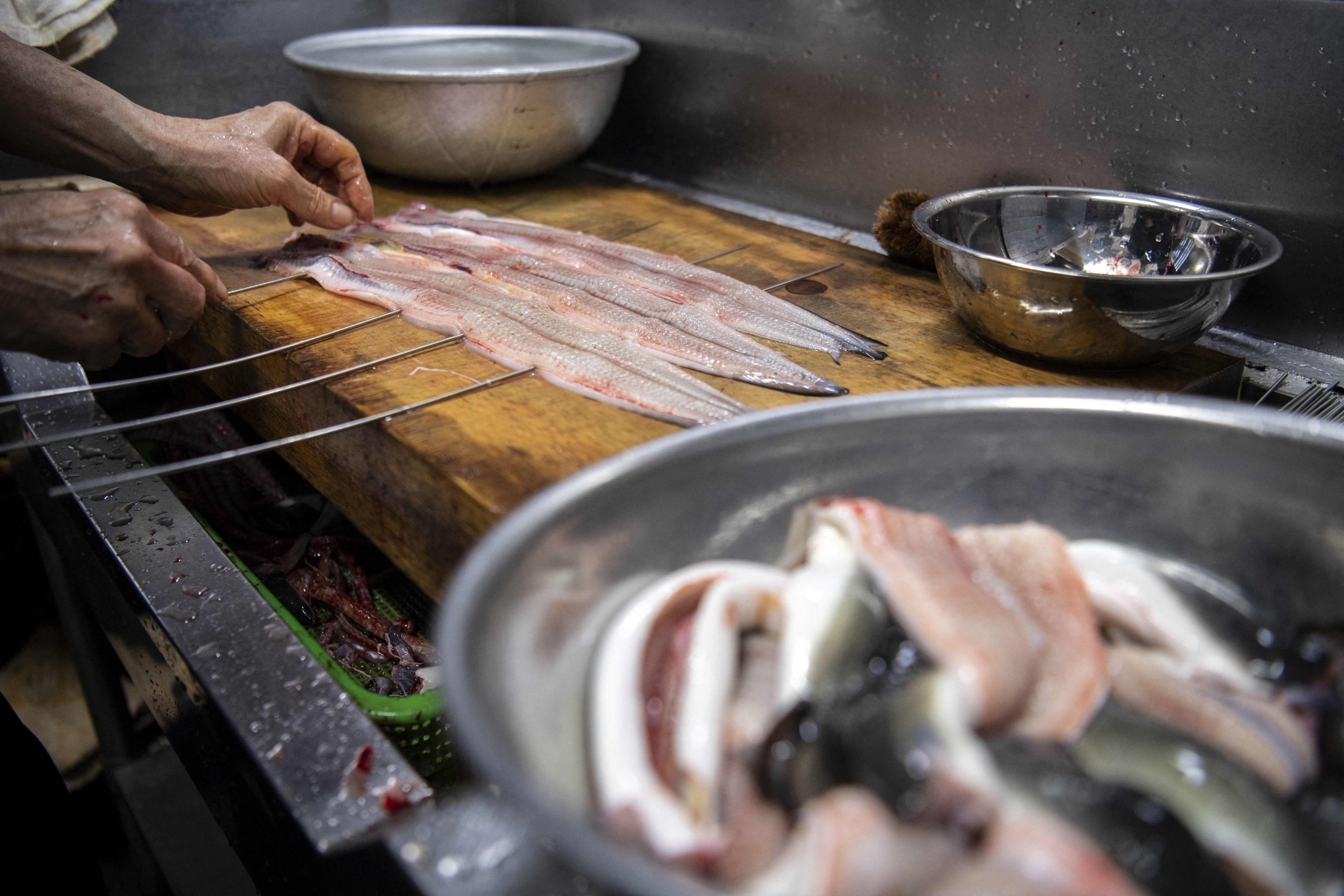 Japanese chef Tsuyoshi Hachisuka prepares eel at his restaurant in Hamamatsu, Shizuoka prefecture, Japan, April 16, 2021. (AFP Photo)