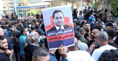 Supporters of Hezbollah, Amal and the Christian Marada movement take part in a protest against Tarek Bitar, the lead judge of the port blast investigation, near the Justice Palace in Beirut, Lebanon, Oct.14, 2021. (REUTERS)