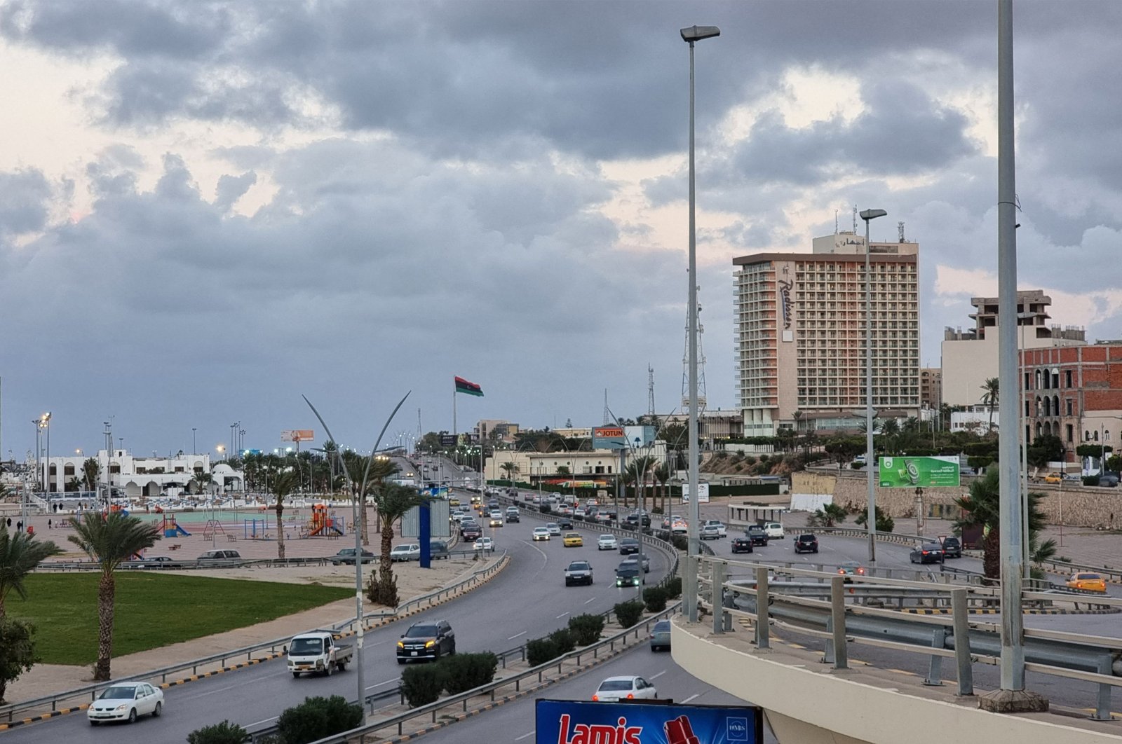 Vehicles drive along the main Shat Road by the waterfront in Libya&#039;s capital Tripoli, Dec. 13, 2021. (AFP Photo)