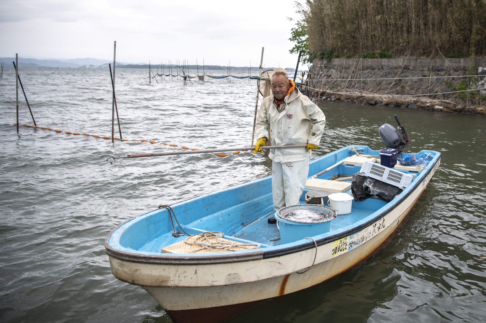 An eel fisherman Kunihiko Kato checks his nets in Hamamatsu, Shizuoka prefecture, Japan, April 16, 2021. (AFP Photo)
