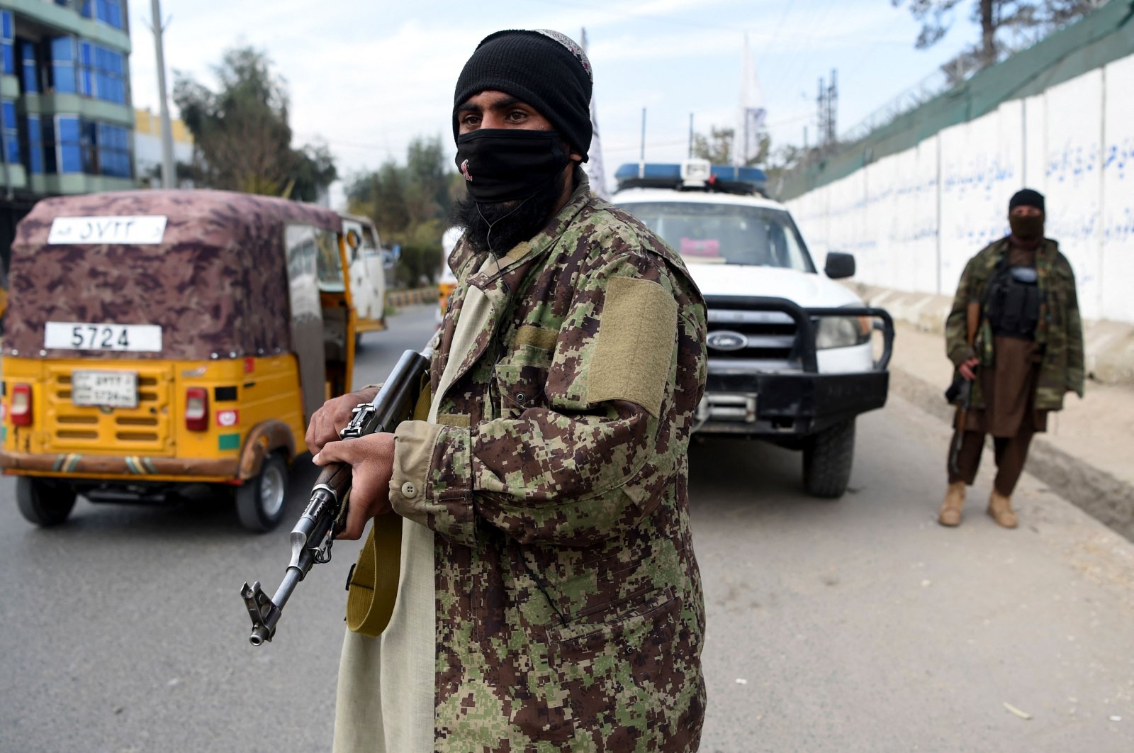 Taliban fighters stand guard along a roadside in Jalalabad, Dec. 12, 2021. (AFP Photo)