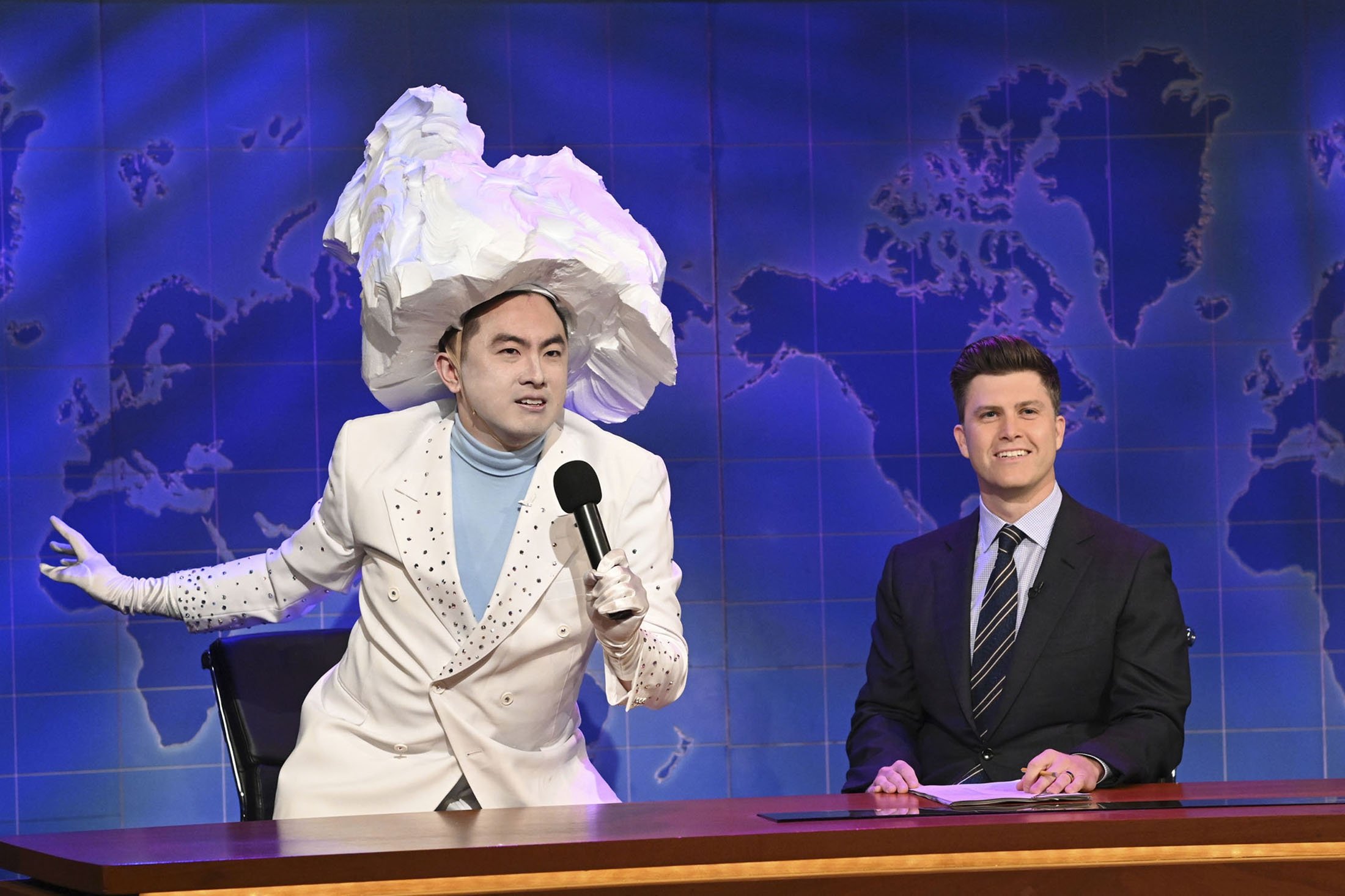 Bowen Yang (L) as the Iceberg that sank the Titanic, and anchor Colin Jost during Weekend Update on “Saturday Night Live,” in New York, U.S., April 10, 2021. (NBC via AP)