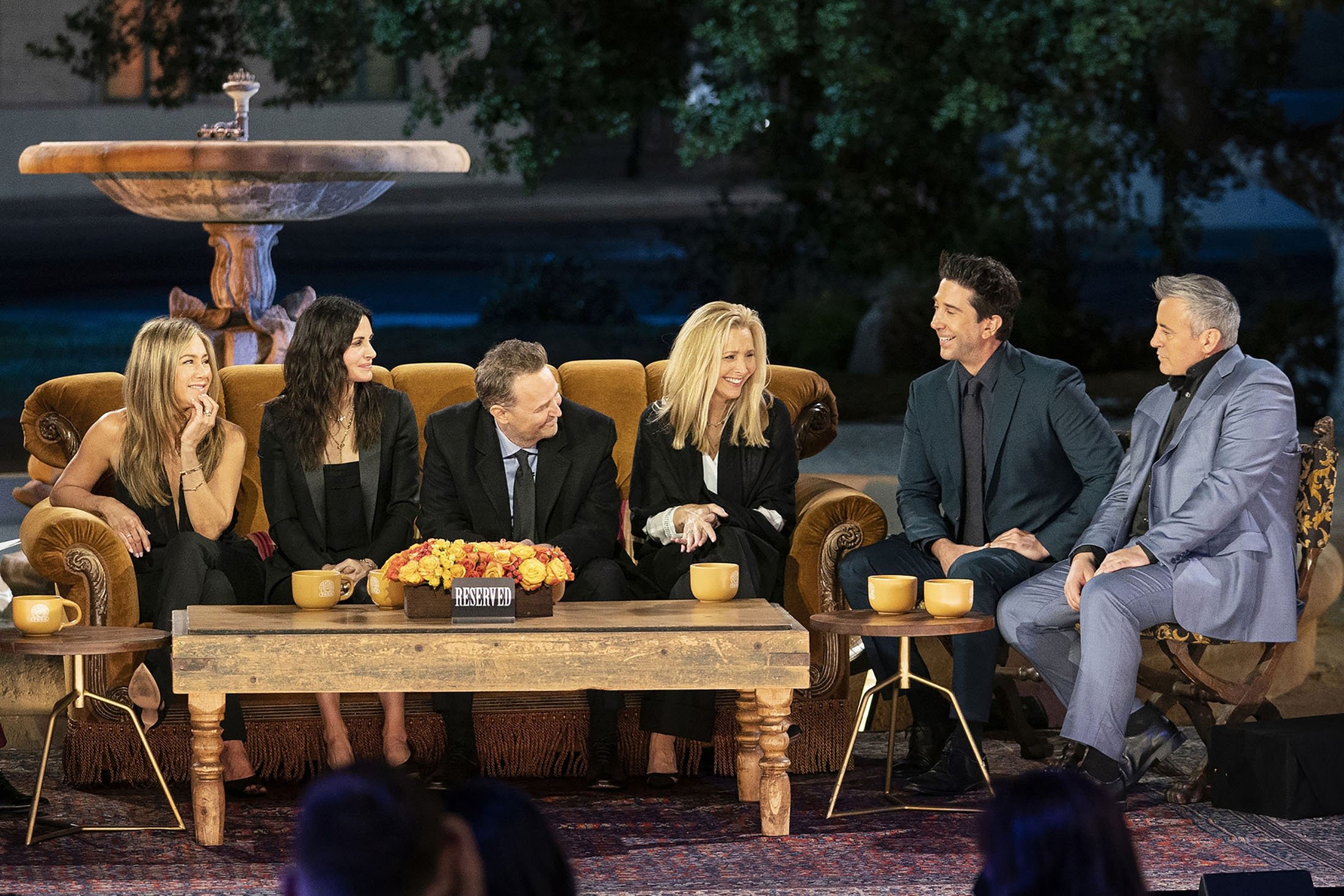 The cast of “Friends,” from left to right, Jennifer Aniston, Courteney Cox, Matthew Perry, Lisa Kudrow, David Schwimmer and Matt Leblanc, during a taping of the special “Friends: The Reunion.” (HBO Max via AP)