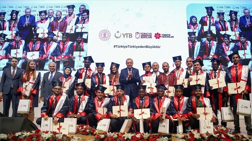 President Recep Tayyip Erdoğan (C) poses with graduates of Turkish universities from African countries and other countries, at a graduation ceremony in the capital Ankara, Turkey, July 3, 2019. (AA PHOTO)