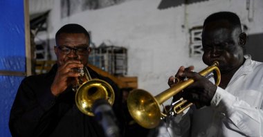 Trumpeters from the Bana OK band play at La Septante club in the Kasa-Vubu quarter of Kinshasa, Democratic Republic of the Congo, Sept. 24, 2021. (REUTERS)