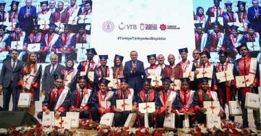 President Recep Tayyip Erdoğan (C) poses with graduates of Turkish universities from African countries and other countries, at a graduation ceremony in the capital Ankara, Turkey, July 3, 2019. (AA PHOTO)