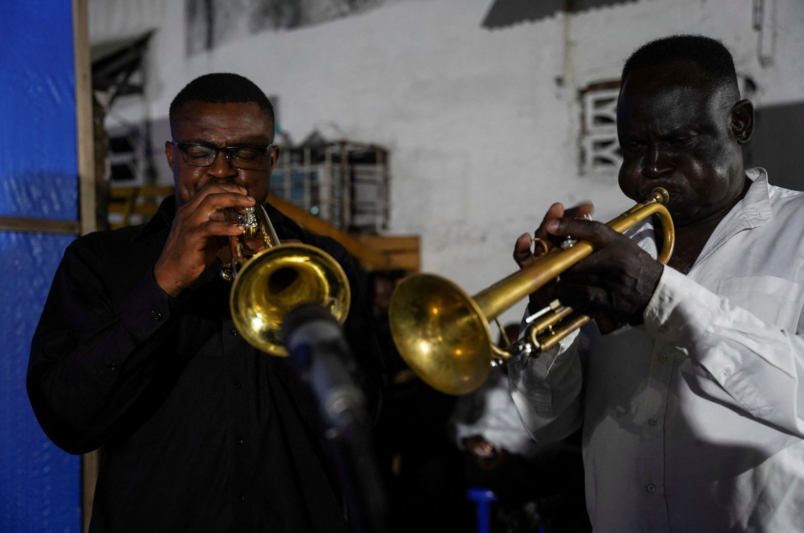 Trumpeters from the Bana OK band play at La Septante club in the Kasa-Vubu quarter of Kinshasa, Democratic Republic of the Congo, Sept. 24, 2021. (REUTERS)