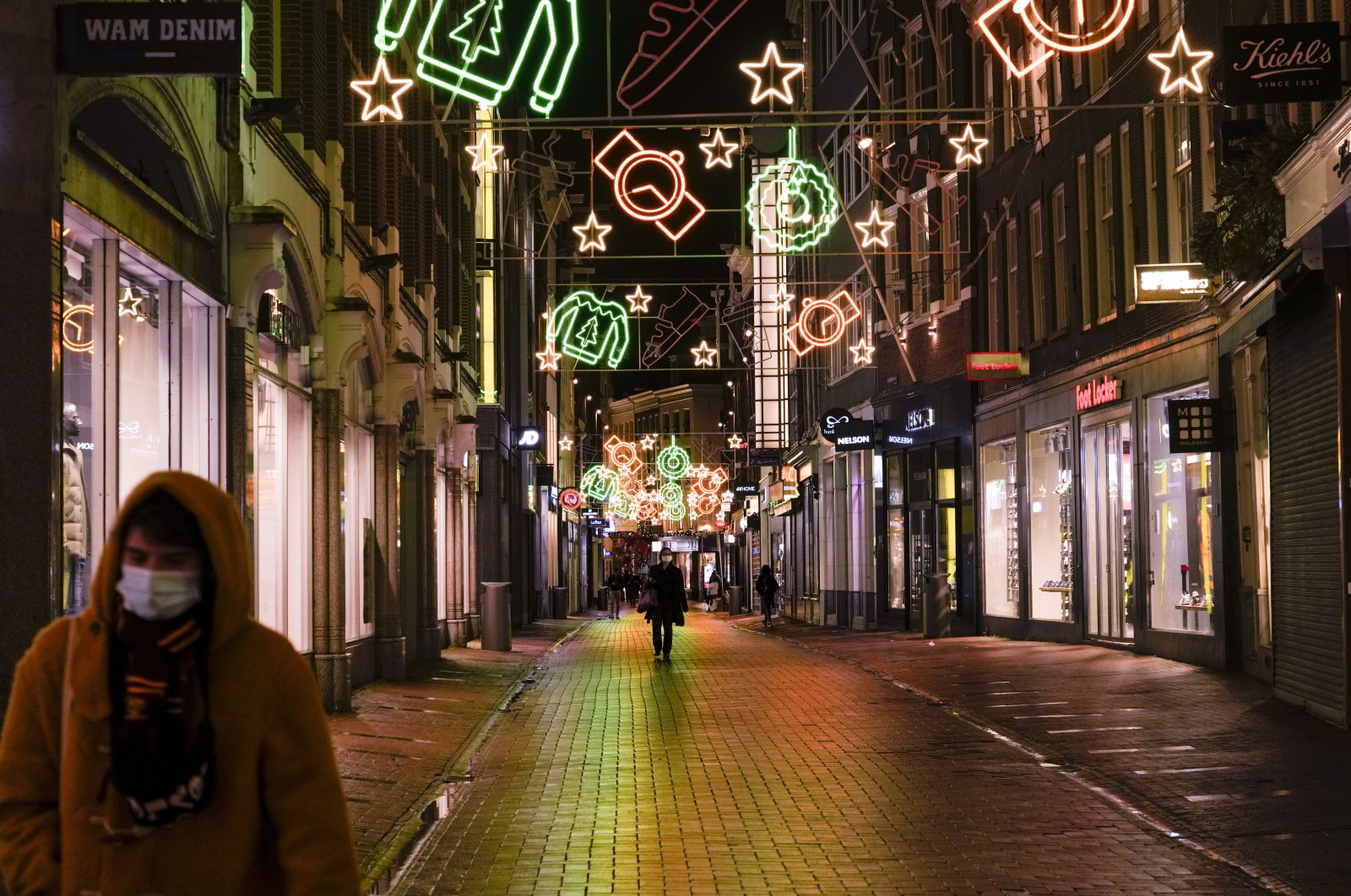 The shopping streets are near-empty after 5 p.m. in Amsterdam, Netherlands, Nov. 29, 2021. (AP Photo)